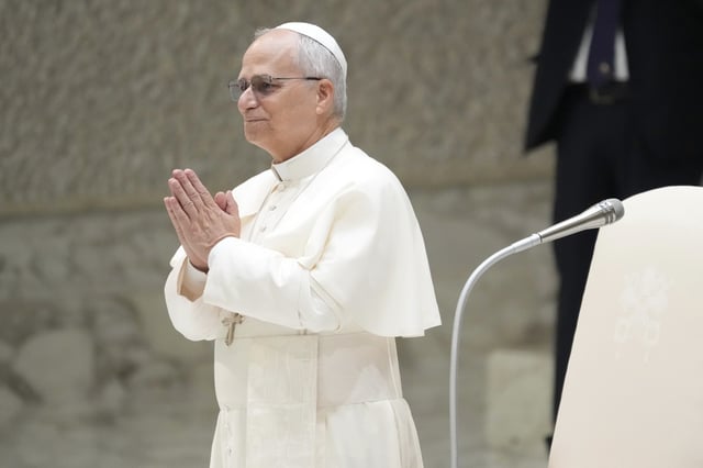 Pope Leo XIV waves as he arrives for his weekly general audience, at The Vatican, Wednesday, Aug.20, 2025. (AP Photo/Gregorio Borgia)
