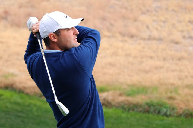 Scottie Scheffler of the PGA Tour plays his shot a the 13th tee during a closest to the pin competition before The Showdown: McIlroy and Scheffler v DeChambeau and Koepka at Shadow Creek Golf Course on December 16, 2024 in Las Vegas, Nevada.