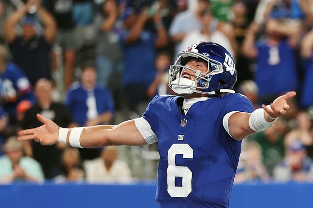 Jaxson Dart #6 of the New York Giants reacts after throwing a touchdown pass during the second half of the NFL Preseason 2025 game between New York Jets and New York Giants at MetLife Stadium on August 16, 2025 in East Rutherford, New Jersey. The Giants won 31-12.