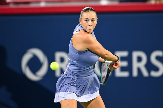FILE PHORO: Aug 3, 2025; Montreal, QC, Canada; Amanda Anisimova (USA) returns the ball to Elina Svitolina (UKR) in fourth round play at IGA Stadium. Mandatory Credit: David Kirouac-Imagn Images/File Photo