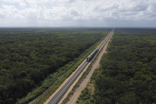 FILE - The inaugural Mayan Train with President Andrés Manuel López Obrador on board passes near Chochola, Quintana Roo State, Mexico, Dec. 15, 2023. (AP Photo/Martin Zetina, File)