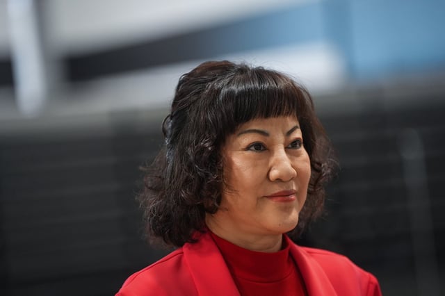 Billionaire Ruby Liu listens during an interview at a former Hudson's Bay-owned Saks Off 5th department store after a "handover ceremony" where she received the keys to the space at Tsawwassen Mills shopping mall that she owns, in Tsawwassen, B.C., on Thursday, June 26, 2025. THE CANADIAN PRESS/Darryl Dyck