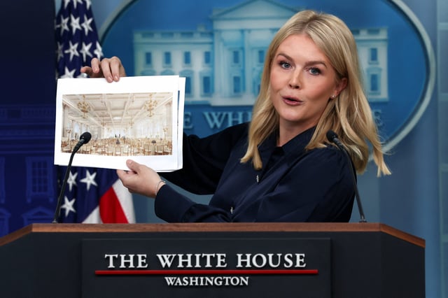 White House Press Secretary Karoline Leavitt holds an image of a rendering of the new White House ballroom to be built, during a press briefing at the White House in Washington, D.C., on July 31, 2025.