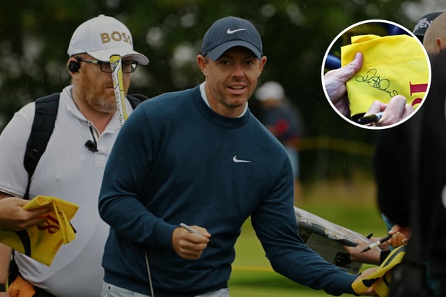 Northern Ireland's Rory McIlroy signs autographs for fans during a practice round ahead of the 152nd British Open Golf Championship at Royal Troon on the south west coast of Scotland on July 16, 2024. (Photo by ANDY BUCHANAN / AFP) / RESTRICTED TO EDITORIAL USE (Photo by ANDY BUCHANAN/AFP via Getty Images)