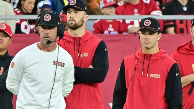 Jan 5, 2025; Glendale, Arizona, USA; San Francisco 49ers quarterback Brock Purdy (right) and head coach Kyle Shanahan (left) look on the in second half against the Arizona Cardinals at State Farm Stadium. Mandatory Credit: Matt Kartozian-Imagn Images