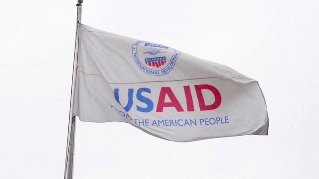 A USAID flag flutters outside the USAID Building in Washington DC | Reuters