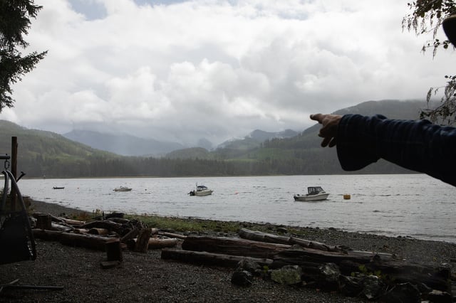 Rain and smoke from the Mount Underwood wildfire can be seen from across the Alberni Inlet at the Macktush Creek Campsite, south of Port Alberni, B.C., on Saturday, Aug. 16, 2025. THE CANADIAN PRESS/Chad Hipolito