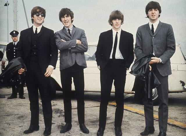 FILE - The Beatles, from left, John Lennon, George Harrison, Ringo Starr and Paul McCartney arrive in Liverpool, England, July 10, 1964. (AP Photo, File)