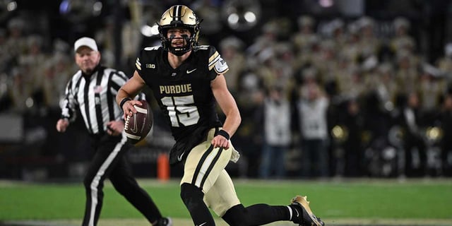 Nov 16, 2024; West Lafayette, Indiana, USA; Purdue Boilermakers quarterback Ryan Browne (15) runs the ball during the second half against the Penn State Nittany Lions at Ross-Ade Stadium. Mandatory Credit: Marc Lebryk-Imagn Images