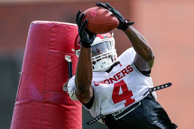 Justin Harrington (4) runs drills during an OU football practice in Norman, Okla., Aug. 7, 2023. (The Oklahoman)