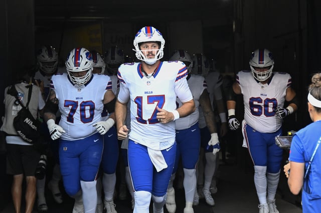 Aug 17, 2025; Chicago, Illinois, USA;  Buffalo Bills quarterback Josh Allen (17) leads the team during warmups before a preseason game against the Chicago Bears at Soldier Field. Mandatory Credit: Matt Marton-Imagn Images/File Photo