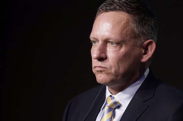 Peter Thiel, co-founder and chairman of Palantir Technologies Inc., pauses during a news conference in Tokyo, Japan, on Monday, Nov. 18, 2019. The billionaire entrepreneur was in Japan to unveil a $150 million, 50-50 joint venture with local financial services firm Sompo Holdings Inc. Palantir Technologies Japan Co. will target government and public sector customers, emphasizing health and cybersecurity initially. Photographer: Kiyoshi Ota/Bloomberg via Getty Images