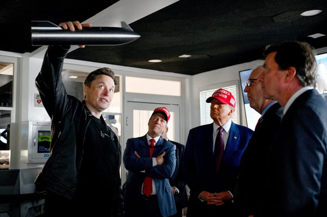 Elon Musk holds a model of SpaceX's Starship spacecraft will giving a tour to then President-elect Donald Trump on Nov. 19, 2025 ahead of a flight test of the massive vehicle intended to ferry the first humans to Mars.