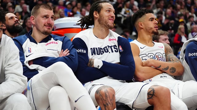 Nuggets center Nikola Jokic (15) and forward Aaron Gordon (32) and forward Michael Porter Jr. (1) on the bench in the fourth quarter against the Phoenix Suns at Ball Arena