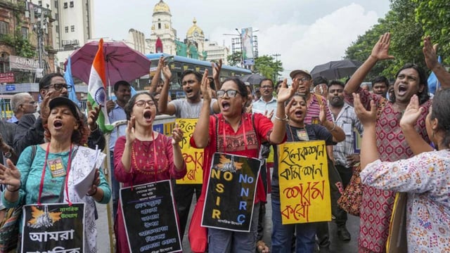 Anti-SIR Citizens Forum activists raise slogans during a protest rally over the Special Intensive Revision (SIR) of electoral rolls in Bihar, in Kolkata, West Bengal, Friday (PTI)