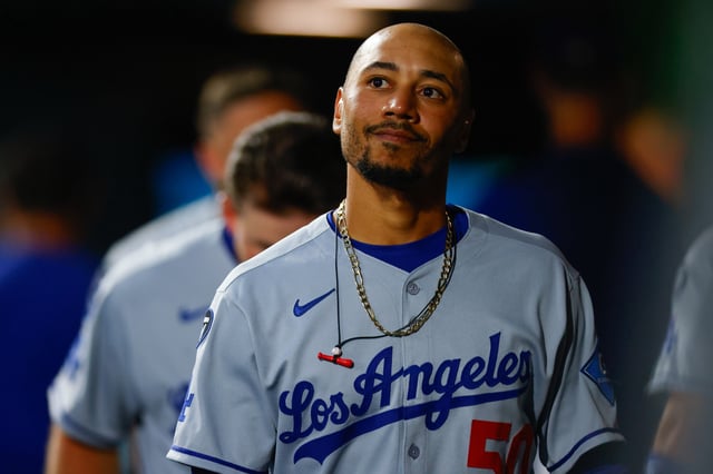 DENVER, CO - AUGUST 18: Mookie Betts #50 of the Los Angeles Dodgers walks in the dugout before taking the field in the fifth inning against the Colorado Rockies at Coors Field on August 18, 2025 in Denver, Colorado. (Photo by Justin Edmonds/Getty Images)