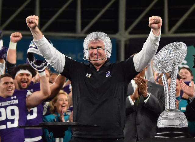 American Football - NCAA - College Football Series - Northwestern Wildcats v Nebraska Cornhuskers - Aviva Stadium, Dublin, Republic of Ireland - August 27, 2022   Northwestern Wildcats head coach Pat Fitzgerald celebrates after the match REUTERS/Clodagh Kilcoyne/ File Photo