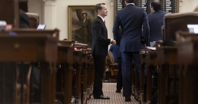 State Rep. Dade Phelan, R-Beaumont, speaks with other representatives on the House floor on May 19, 2025.