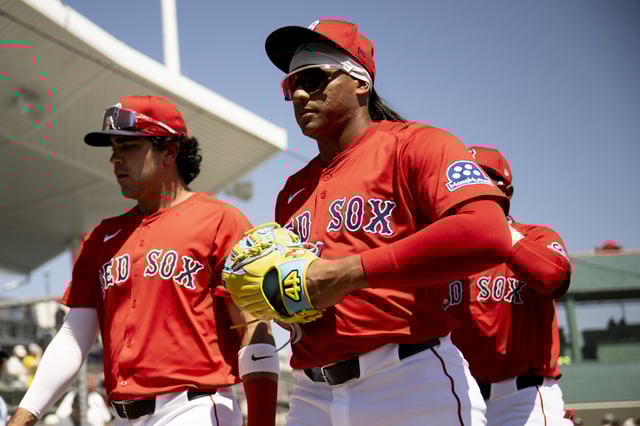 Jhostynxon Garcia #91 of the Boston Red Sox walks into the dugout before an exhibition game against the Minnesota Twins at JetBlue Park at Fenway South on March 14, 2025 in Fort Myers, Florida.