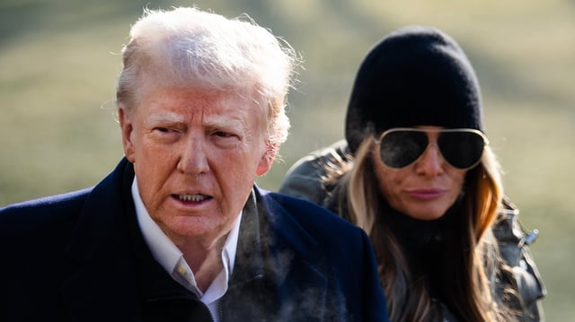 UNITED STATES - JANUARY 24: President Donald Trump and first lady Melania Trump speak to reporters on the South Lawn of the White House before boarding Marine One en route to North Carolina and California on Friday, January 24, 2025. (Tom Williams/CQ-Roll Call, Inc via Getty Images)