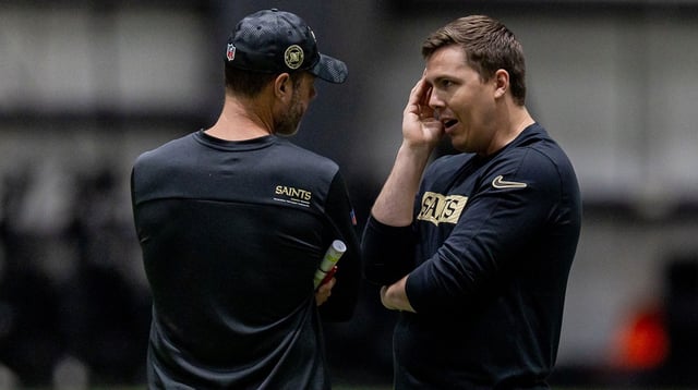 New Orleans Saints head coach Kellen Moore talks with defensive coordinator Brandon Staley during rookie minicamp at Ochsner Sports Performance Center. Mandatory Credit: Stephen Lew-Imagn Images