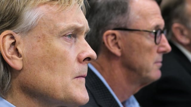 David Thomson, seen in a 2024 file photo with Winnipeg Jets owner Mark Chipman,  says he wants to buy the Hudson's Bay Company's charter and donate it to Manitoba's provincial archives.