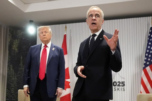 Prime Minister Mark Carney speaks during a meeting with U.S. President Donald Trump on the sidelines of the G7 Summit on Monday, June 16, 2025, in Kananaskis, Alta. (AP Photo/Mark Schiefelbein)