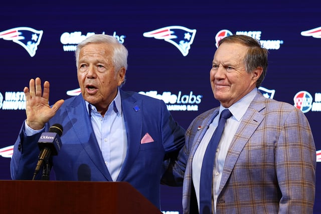 Owner Robert Kraft (L) speaks to the media as head coach Bill Belichick (R) of the New England Patriots looks on during a press conference at Gillette Stadium on January 11, 2024 in Foxborough, Massachusetts. Belichick announced he is stepping down as head coach after 24 seasons with the team.
