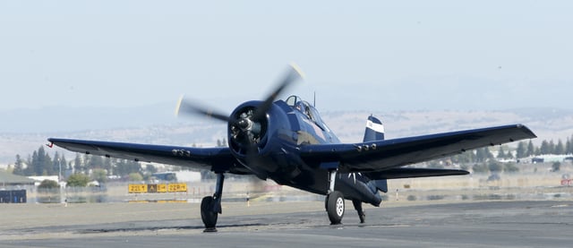 FILE - A World War II era F6F Hellcat taxis after landing at Mather Airport in Rancho Cordova, Calif. Friday Oct. 4, 2019. (AP Photo/Rich Pedroncelli, File)