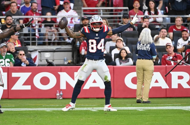 GLENDALE, ARIZONA - DECEMBER 15: Kendrick Bourne #84 of the New England Patriots celebrates a catch against the Arizona Cardinals at State Farm Stadium on December 15, 2024 in Glendale, Arizona.