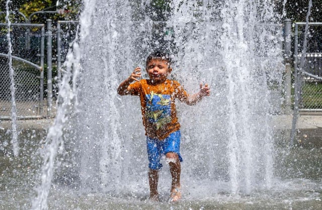 Ezra Martinez plays at the splash pad at Lemon Park in Fullerton, CA on Thursday, Aug. 21, 2025. Temperatures were expected to be in the low-to-mid-90s through the weekend, according to the National Weather Service. (Photo by Paul Bersebach, Orange County Register/SCNG)