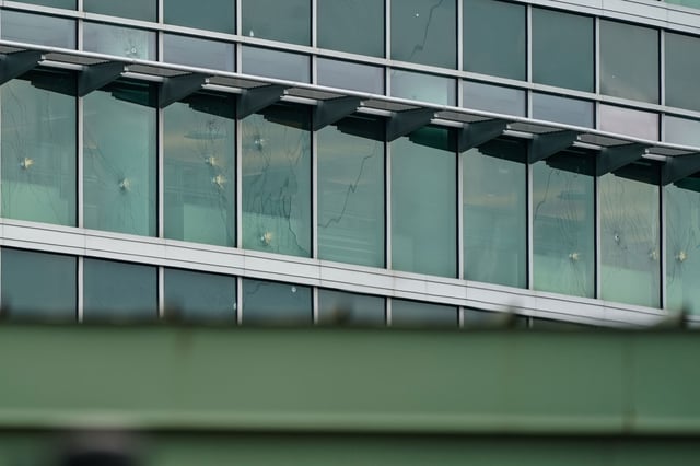 Bullet holes are seen in windows at the Centers For Disease Control Global Headquarters in Atlanta, Georgia, on August 9, 2025.