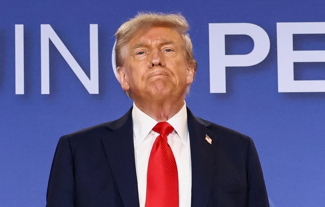 U.S. President Donald Trump attends a press conference following his meeting with Russian President Vladimir Putin to negotiate an end to the war in Ukraine, at Joint Base Elmendorf-Richardson, in Anchorage, Alaska, U.S., August 15, 2025.