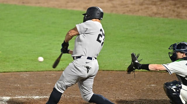 Aug 20, 2025; St. Petersburg, Florida, USA; New York Yankees pinch hitter Giancarlo Stanton (27) hits a two run home run in the ninth inning against the Tampa Bay Rays at George M. Steinbrenner Field. Mandatory Credit: Jonathan Dyer-Imagn Images