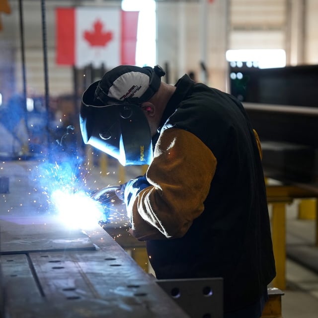 A worker welds at a steel manufacturing facility, in Hamilton, Ont., Wednesday, July 16, 2025. THE CANADIAN PRESS/Chris Young