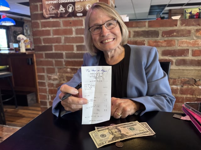 Rep. Mariannette Miller-Meeks (R-Iowa) shows a restaurant check in an attempt to promote the "One Big Beautiful Bill's “no tax on tips” provision.