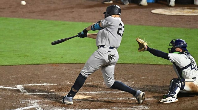 Aug 19, 2025; St. Petersburg, Florida, USA; New York Yankees right fielder fielder Giancarlo Stanton (27) hits a three run home run in the fourth inning against the Tampa Bay Rays at George M. Steinbrenner Field. Mandatory Credit: Jonathan Dyer-Imagn Images
