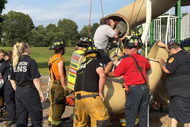 Vernon firefighters help to release a trapped 40-year-old man from a tube slide, in Vernon, Conn., on Aug. 16, 2025.
