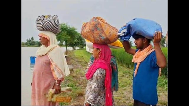 Villagers of flood-affected areas move to safer places in Ferozepur on Thursday. (HT Photo)