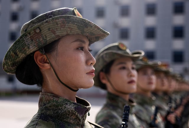 Members of China's Militia attend training ahead of a military parade to mark the 80th anniversary of the end of World War Two, in Beijing, China, August 20, 2025. REUTERS/Maxim Shemetov