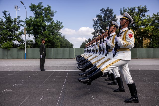 Soldiers of the People's Liberation Army (PLA) of China march during training ahead of a military parade to mark the 80th anniversary of the end of World War Two, in Beijing, China, August 20, 2025. REUTERS/Maxim Shemetov