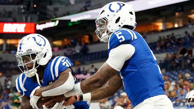 Aug 16, 2025; Indianapolis, Indiana, USA; Indianapolis Colts running back Tyler Goodson (31) receives a handoff from Indianapolis Colts quarterback Anthony Richardson Sr. (5) during warmups prior to the game against the Green Bay Packers at Lucas Oil Stadium. Mandatory Credit: Robert Goddin-Imagn Images.