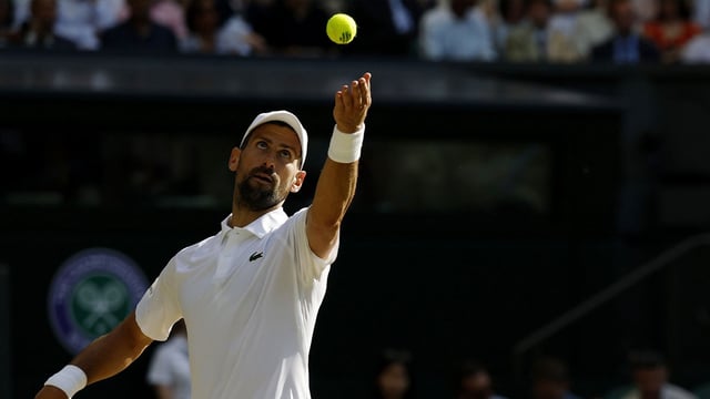 Jul 11, 2025; Wimbledon, United Kingdom; Novak Djokovic (SRB) serves against Jannik Sinner (ITA)(not pictured) in a gentlemen's singles semi-final on day twelve of The Championships Wimbledon 2025 at All England Lawn Tennis and Croquet Club. Mandatory Credit: Geoff Burke-Imagn Imagea