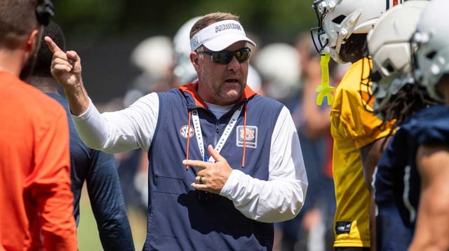 Auburn Tigers head coach Hugh Freeze talks with wide receiver Cam Coleman (8) during practice at Woltosz Football Performance Center in Auburn, Ala. on Thursday, Aug. 14, 2025. Jake Crandall/ Advertiser / USA TODAY NETWORK via Imagn Images
