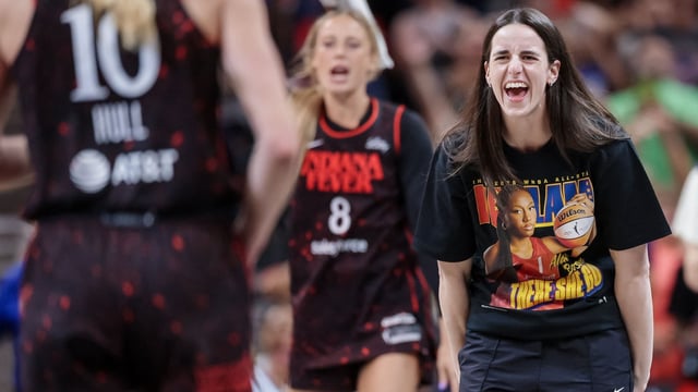 Caitlin Clark #22 of the Indiana Fever (R) celebrates at the conclusion of the game against the Chicago Sky