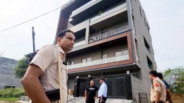 Security personnel after gunfire reported at YouTuber Elvish Yadav's residence, in Gurugram