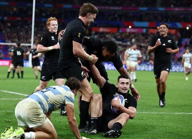 Rugby Union - Rugby World Cup 2023 - Semi Final - Argentina v New Zealand - Stade de France, Saint-Denis, France - October 20, 2023 New Zealand's Will Jordan celebrates scoring their seventh try and completing his hat-trick with teammates REUTERS/Stephanie Lecocq/File Photo