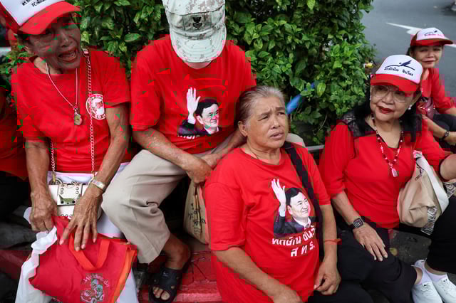 Pheu Thai supporters gather outside the criminal, on the day of a Thai criminal court's verdict in former Prime Minister Thaksin Shinawatra's lese majeste case, also known as a royal insult case, under Section 112 of Thailand's Criminal Code, stemming from a 2015 interview he gave while in South Korea during his long stint in self-imposed exile, in Bangkok, Thailand, August 22, 2025. REUTERS/Athit Perawongmetha