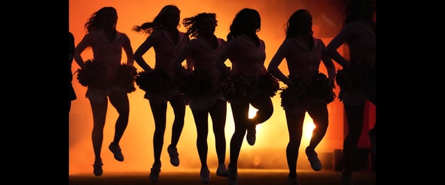 Cheerleaders perform before the start of an NFL football game between the Kansas City Chiefs and the New Orleans Saints Monday, Oct. 7, 2024, in Kansas City, Mo. (AP Photo/Charlie Riedel)