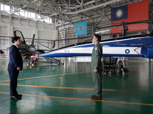 Taiwan's President Lai Ching-te, left, listens to a briefing about a T-BE5A Brave Eagle, Fifth-Generation Advanced Jet Trainer as he visits to inspect Taiwanese Air Force at a military base in Taitung County, eastern Taiwan, Tuesday, Jan. 21, 2025. (Chiang Ying-ying/AP)